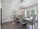 Elegant dining room with a large wooden table, upholstered chairs, and natural light from the windows at 4332 John Hatch Dr, Johns Island, SC 29455