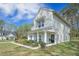 Charming two-story home features a welcoming front porch and manicured landscaping at 4332 John Hatch Dr, Johns Island, SC 29455