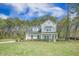 Charming two-story home with manicured landscaping and a long driveway at 4332 John Hatch Dr, Johns Island, SC 29455