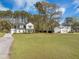 Charming two-story home with a large front yard, well-manicured lawn, and a classic design at 4332 John Hatch Dr, Johns Island, SC 29455