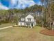 Charming two-story home with a landscaped front yard and a basketball hoop on the side at 4332 John Hatch Dr, Johns Island, SC 29455