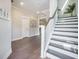 Charming foyer with hardwood floors, staircase, and elegant decor creating a welcoming entrance at 4332 John Hatch Dr, Johns Island, SC 29455