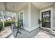 Inviting front porch with stylish seating, decor, and a welcoming doormat at 4332 John Hatch Dr, Johns Island, SC 29455