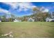 Expansive front yard showcases beautiful craftsman-style homes under a partly cloudy blue sky at 4332 John Hatch Dr, Johns Island, SC 29455