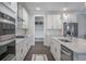 Modern kitchen featuring stainless steel appliances, white cabinets, and convenient access to mudroom at 4332 John Hatch Dr, Johns Island, SC 29455