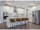 Modern kitchen features white cabinets, stainless steel appliances, a center island, and barstool seating at 4332 John Hatch Dr, Johns Island, SC 29455