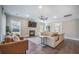 Cozy living room features a fireplace, comfortable leather furniture, and modern decor at 4332 John Hatch Dr, Johns Island, SC 29455
