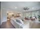 Bright, open-concept living space with hardwood floors, comfortable seating, and a view of the kitchen at 4332 John Hatch Dr, Johns Island, SC 29455