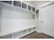 White mudroom featuring built-in bench seating, shelving, hooks, and basket storage at 4332 John Hatch Dr, Johns Island, SC 29455