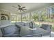 Relaxing screened porch with comfortable seating, ceiling fan, and outdoor views at 4332 John Hatch Dr, Johns Island, SC 29455