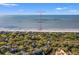 Aerial view of 4338 Sea Forest Dr. located within a forest of trees, and near the beach at 4338 Sea Forest Dr, Kiawah Island, SC 29455