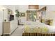 Inviting bedroom with access to a balcony, dresser with TV, and ample natural light at 4338 Sea Forest Dr, Kiawah Island, SC 29455