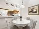 Bright dining area features a passthrough to the kitchen and coastal-themed decorations at 4338 Sea Forest Dr, Kiawah Island, SC 29455