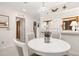 Cozy dining area with pendant lighting and a view of the kitchen through a passthrough at 4338 Sea Forest Dr, Kiawah Island, SC 29455