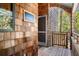 Charming shingle-style condo featuring a covered porch with wooded views and the unit number at 4338 Sea Forest Dr, Kiawah Island, SC 29455