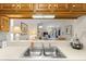 Kitchen with sink and view into the living area, offering a bright and open feel at 4338 Sea Forest Dr, Kiawah Island, SC 29455
