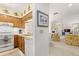 Efficient kitchen with wood cabinets that opens into the dining and living areas at 4338 Sea Forest Dr, Kiawah Island, SC 29455