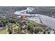 Property aerial showing homes nestled among lush greenery with access to tranquil waters at 4584 Olde Smoak House Rd, Meggett, SC 29449