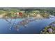 Overhead view of waterfront homes with private piers and a red location pin at 4584 Olde Smoak House Rd, Meggett, SC 29449
