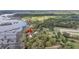 Expansive aerial view of estate with private dock and lush surrounding landscape at 4584 Olde Smoak House Rd, Meggett, SC 29449