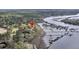 Aerial view showcasing home on wooded lot with private dock at 4584 Olde Smoak House Rd, Meggett, SC 29449