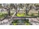 Unique backyard pond and wooden dock leading to waterfront offer a serene outdoor experience at 4584 Olde Smoak House Rd, Meggett, SC 29449