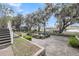 Backyard view of a fish pond with a walkway to the waterfront at 4584 Olde Smoak House Rd, Meggett, SC 29449
