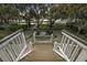 An exterior shot of a backyard featuring a fish pond and stairs leading up to it at 4584 Olde Smoak House Rd, Meggett, SC 29449