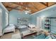 Spacious bedroom with bunk beds, casual seating, and wooden ceiling beams at 4584 Olde Smoak House Rd, Meggett, SC 29449