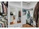 Bright, organized closet with mirrored doors and hardwood floors provides ample storage space at 4584 Olde Smoak House Rd, Meggett, SC 29449