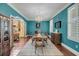 A formal dining room with hardwood floors, a chandelier, and plenty of space for entertaining at 4584 Olde Smoak House Rd, Meggett, SC 29449