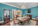 A formal dining room with hardwood floors, a chandelier, and plenty of space for entertaining at 4584 Olde Smoak House Rd, Meggett, SC 29449