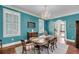A formal dining room with hardwood floors, a chandelier, and plenty of space for entertaining at 4584 Olde Smoak House Rd, Meggett, SC 29449