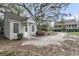 Exterior view of home with a separate guest house, lush landscaping, and circular driveway at 4584 Olde Smoak House Rd, Meggett, SC 29449