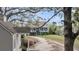 Charming two-story home featuring a picturesque wrap-around porch and a long, winding driveway through a lush, landscaped yard at 4584 Olde Smoak House Rd, Meggett, SC 29449
