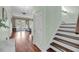 Hallway view of stairs leading up to other rooms at 4584 Olde Smoak House Rd, Meggett, SC 29449