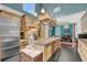 Spacious kitchen features stainless steel appliances and kitchen island at 4584 Olde Smoak House Rd, Meggett, SC 29449