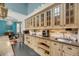 Kitchen with custom cabinets, tile backsplash, and granite countertops at 4584 Olde Smoak House Rd, Meggett, SC 29449