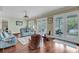 Spacious living room with hardwood floors and view of outdoor balcony at 4584 Olde Smoak House Rd, Meggett, SC 29449