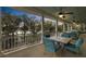Charming lake views from this outdoor patio with covered seating and ceiling fans at 4584 Olde Smoak House Rd, Meggett, SC 29449