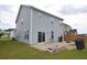 A spacious backyard featuring a patio, lawn, and a basketball hoop at 470 Spectrum Rd, Summerville, SC 29486