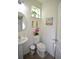 A clean bathroom featuring a pedestal sink, toilet, and decor at 470 Spectrum Rd, Summerville, SC 29486