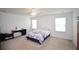 Bright bedroom with floral bedding, neutral walls, and plenty of natural light at 470 Spectrum Rd, Summerville, SC 29486