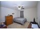 Comfortable bedroom features a ceiling fan, neutral-toned walls, and soft carpeting at 470 Spectrum Rd, Summerville, SC 29486
