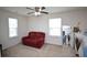 Cozy bonus room with seating, natural light from windows, and neutral carpet at 470 Spectrum Rd, Summerville, SC 29486