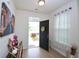 Inviting foyer with a decorated console table and an open front door view at 470 Spectrum Rd, Summerville, SC 29486