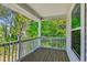 Picturesque covered porch with a serene view of lush green trees and a sense of privacy at 5035 Gum Tree Ln, Johns Island, SC 29455
