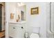 Clean bathroom with white vanity, modern fixtures, a large mirror, and a toilet with neutral decor at 5035 Gum Tree Ln, Johns Island, SC 29455