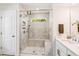 Bright bathroom featuring a glass shower with marble tiling, a built-in bench, and a view to the outside at 5035 Gum Tree Ln, Johns Island, SC 29455