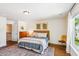 Bedroom featuring a comfortable bed, hardwood floors, and a large window at 5035 Gum Tree Ln, Johns Island, SC 29455